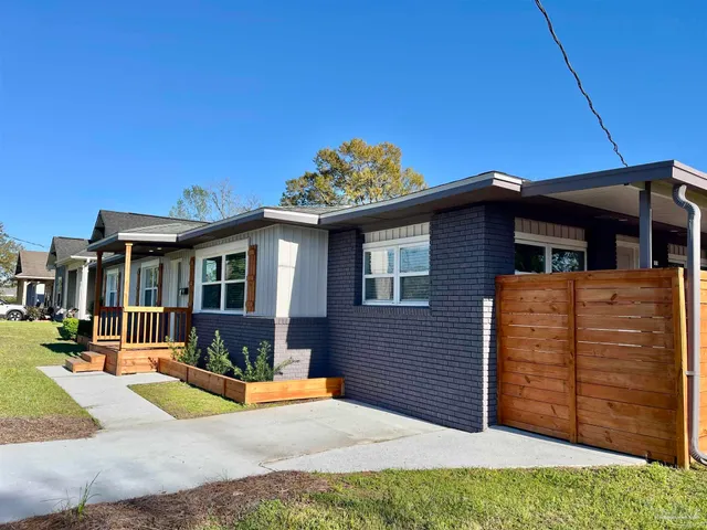 a kitchen with cabinets a sink and appliances