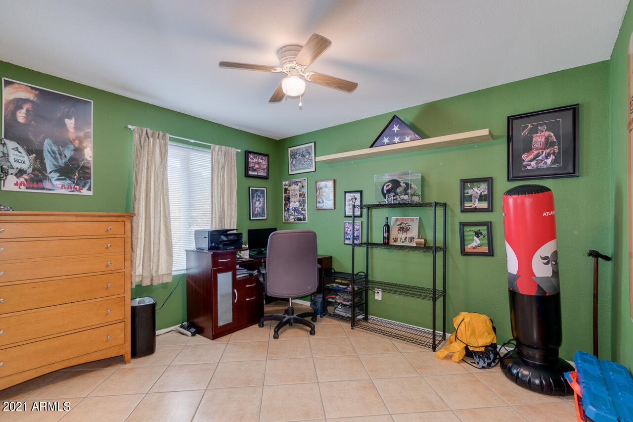 4215 West Dailey Street Phoenix, AZ 85053 - Photo 20 of 32 a bedroom with furniture and a fan