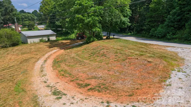 a view of a backyard with a bench