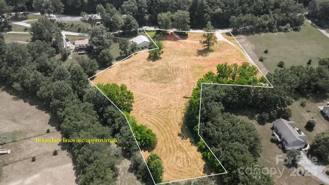 an aerial view of a house with outdoor space