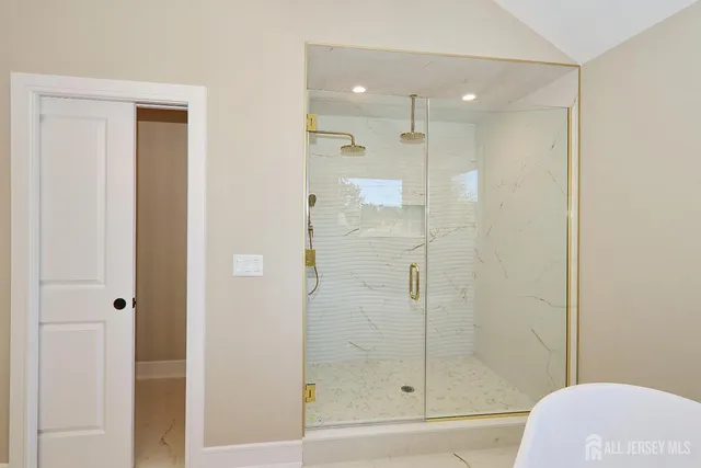 a bathroom with a shower and toilet