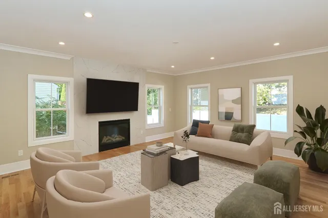a living room with furniture a window and a fireplace