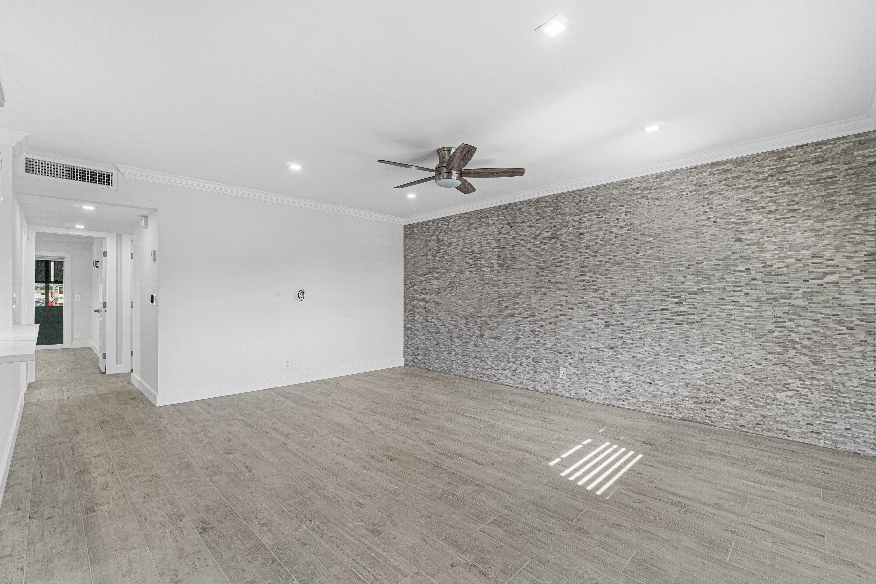 80 Flanders B Delray Beach, FL 33484 - Photo 12 of 26 a view of an empty room with a ceiling fan