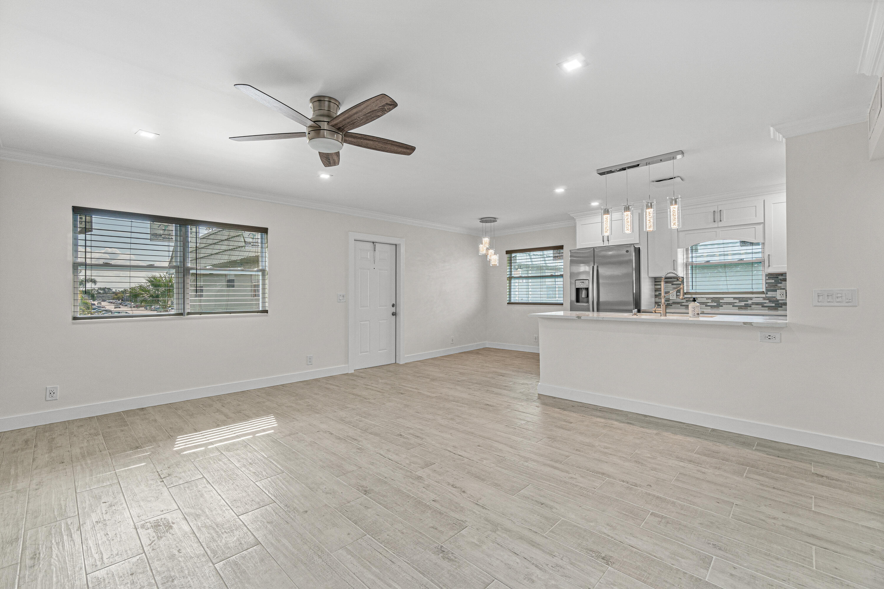 80 Flanders B Delray Beach, FL 33484 - Photo 6 of 26 a view of a kitchen with a sink and cabinets