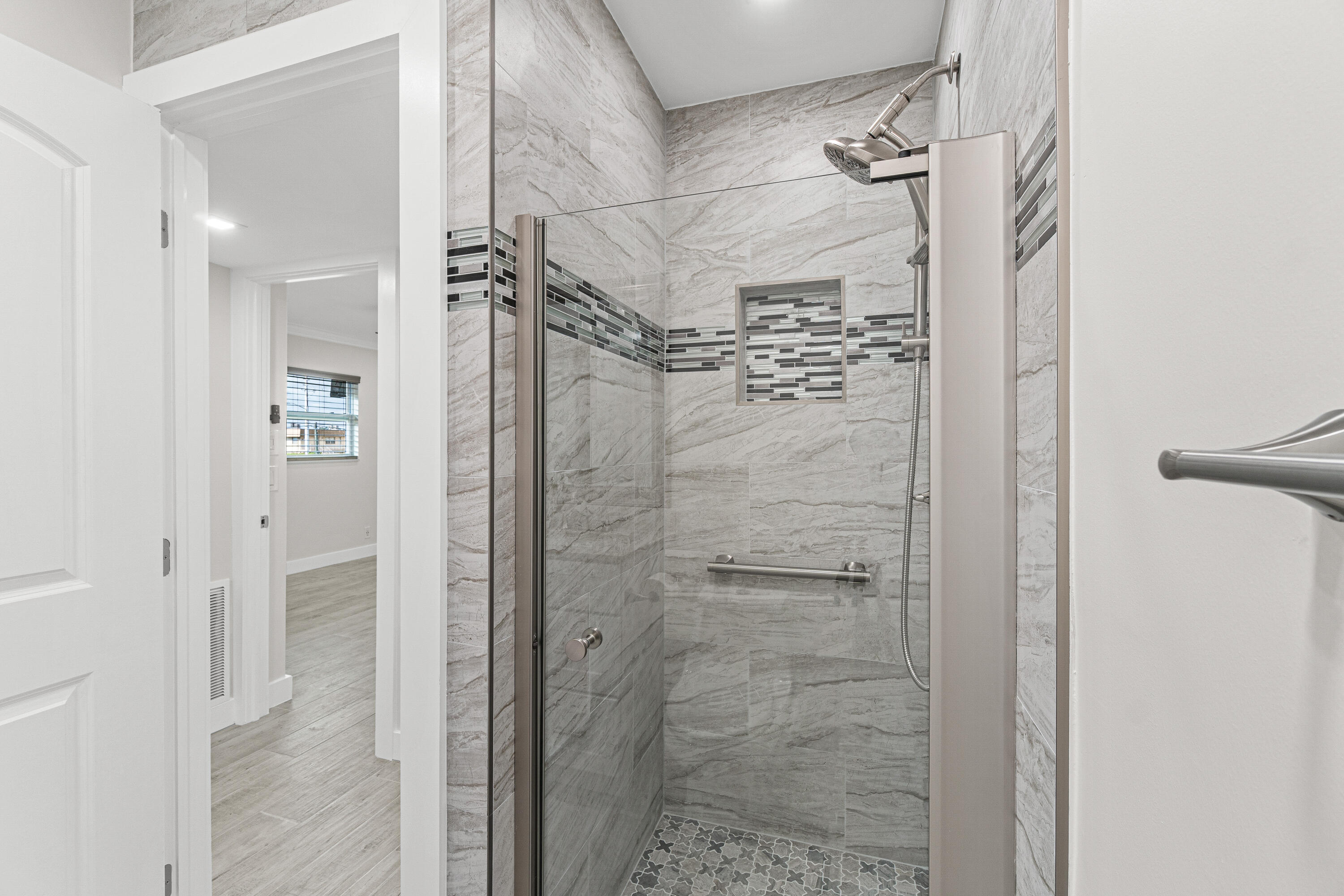 80 Flanders B Delray Beach, FL 33484 - Photo 8 of 26 a bathroom with a shower