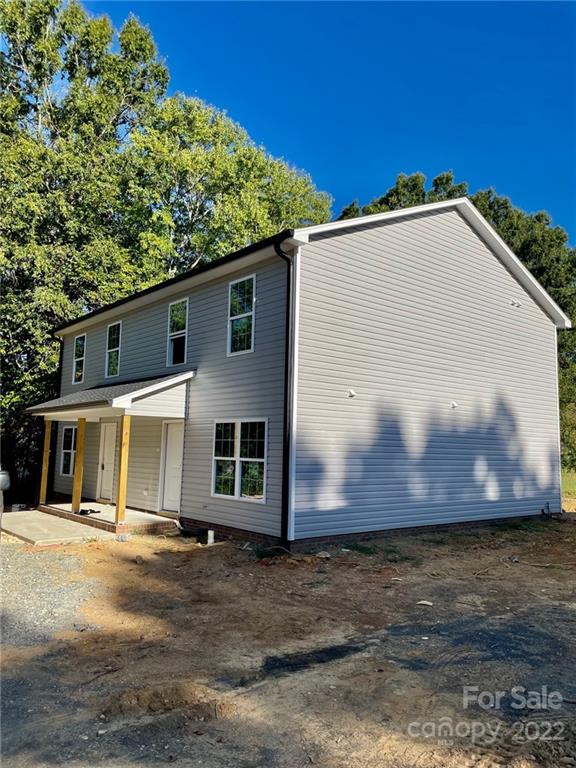 1466 B Street Mount Pleasant, NC 28124 - Photo 2 of 5 a view of a house with a yard