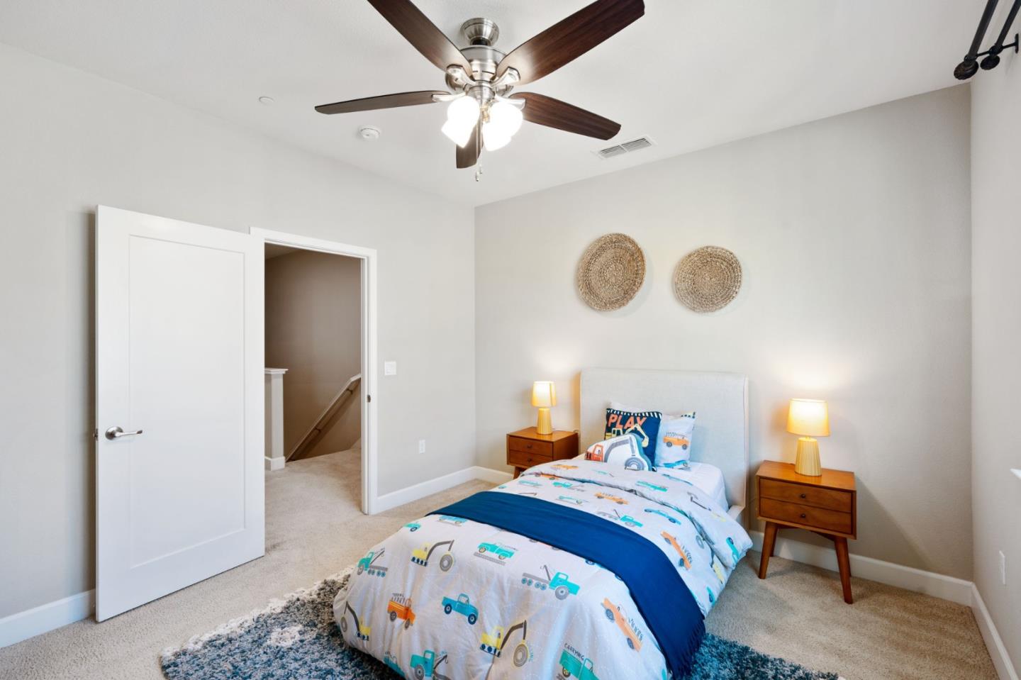 5977 Larkstone Loop San Jose, CA 95123 - Photo 34 of 63 a bedroom with a bed and a chandelier