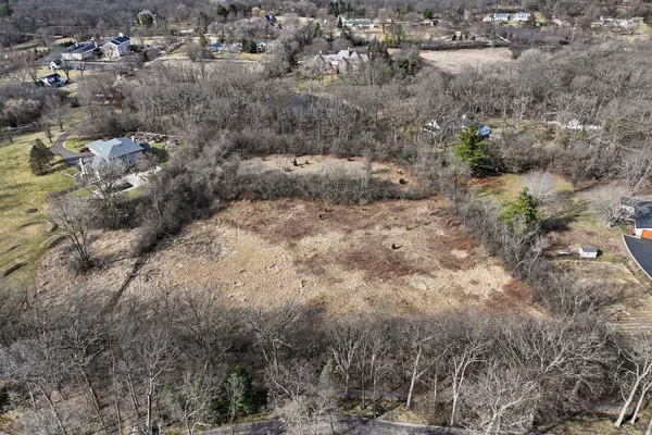 an aerial view of residential house with outdoor space