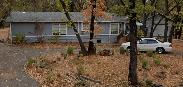 a view of a car park in front of house