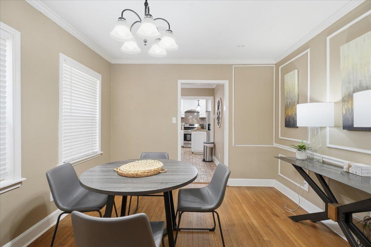 2702 20th Street Lubbock, TX 79410 - Photo 12 of 34 a view of a dining room with furniture and wooden floor