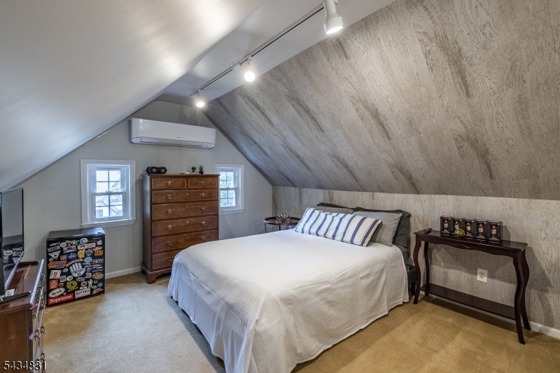 200 Wychwood Road Westfield, NJ 07090 - Photo 25 of 31 a bedroom with a bed and a couch