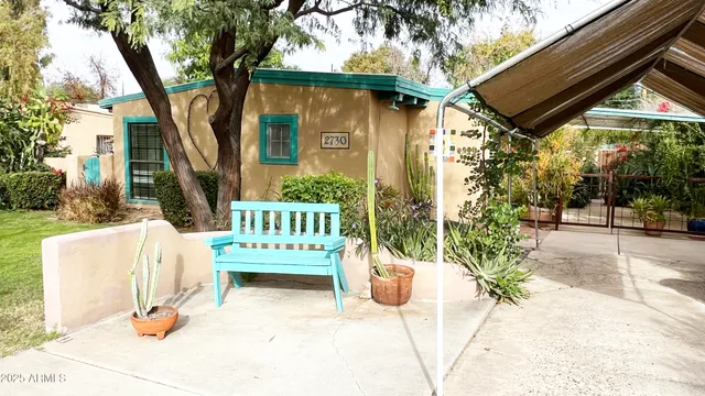 a view of a chair and table in the patio