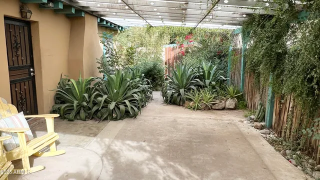 a view of a chair and table in the patio
