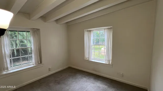 a view of a room that has a window in it