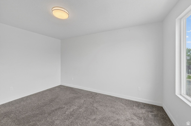 295 Spruce Way Santaquin, UT 84655 - Photo 18 of 32 Neutral-toned interior room featuring light gray carpet, white walls, and a single window with white trim