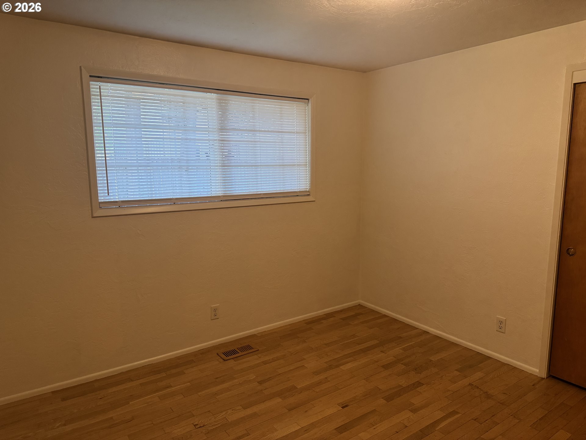260 Susan Street Eugene, OR 97404 - Photo 20 of 33 a view of empty room with wooden floor and fan
