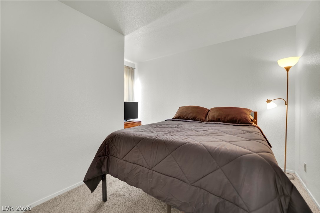 8057 Cimarron Ridge Drive Las Vegas, NV 89128 - Photo 21 of 28 Guest Bedroom