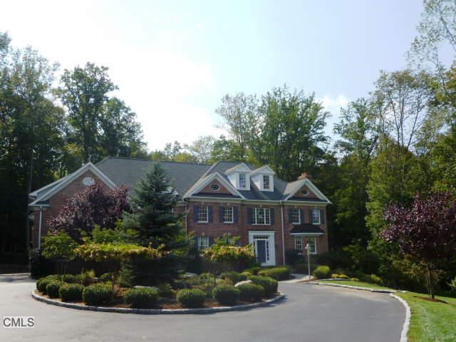 25 Teahouse Lane Ridgefield, CT 06877 - Photo 1 of 1 a front view of a house with a yard