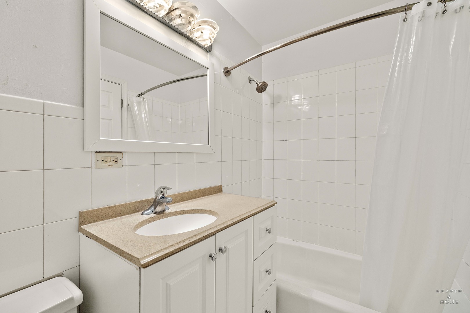 9500 Dee Road, Unit 2F Des Plaines, IL 60016 - Photo 11 of 20 a bathroom with a sink a toilet and shower