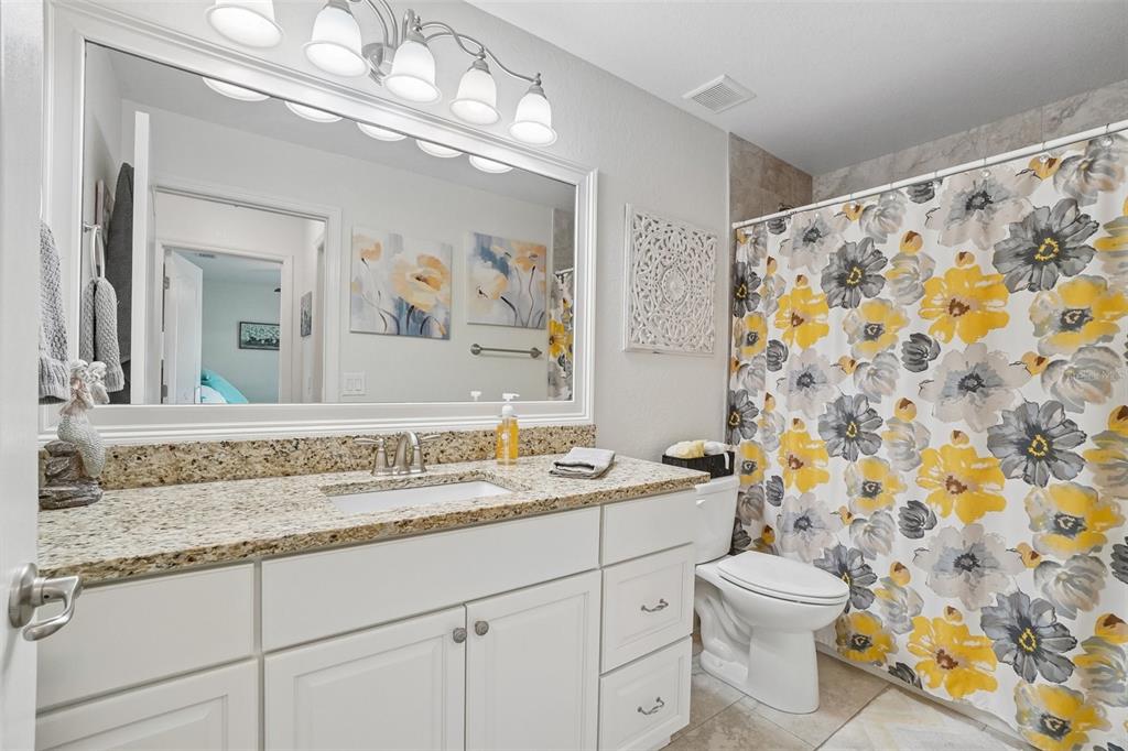 3934 Connersville Road Bartow, FL 33830 - Photo 42 of 81 a bathroom with a granite countertop sink a toilet and a mirror