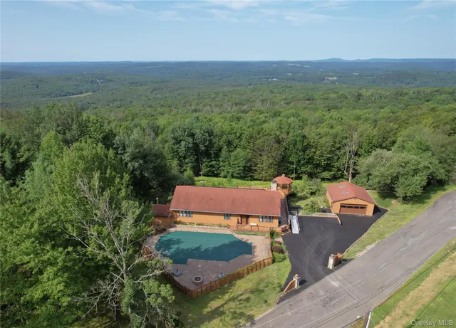 an aerial view of a house with a garden