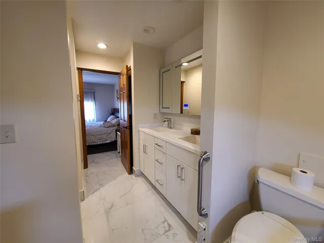 a bed room with a bed and a chandelier