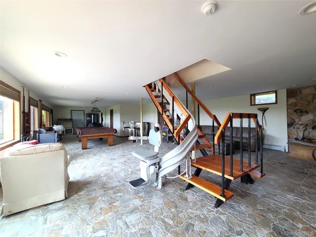 a view of a backyard with sitting area