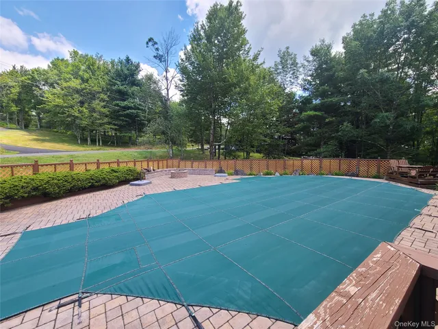 an aerial view of a house with garden space and street view