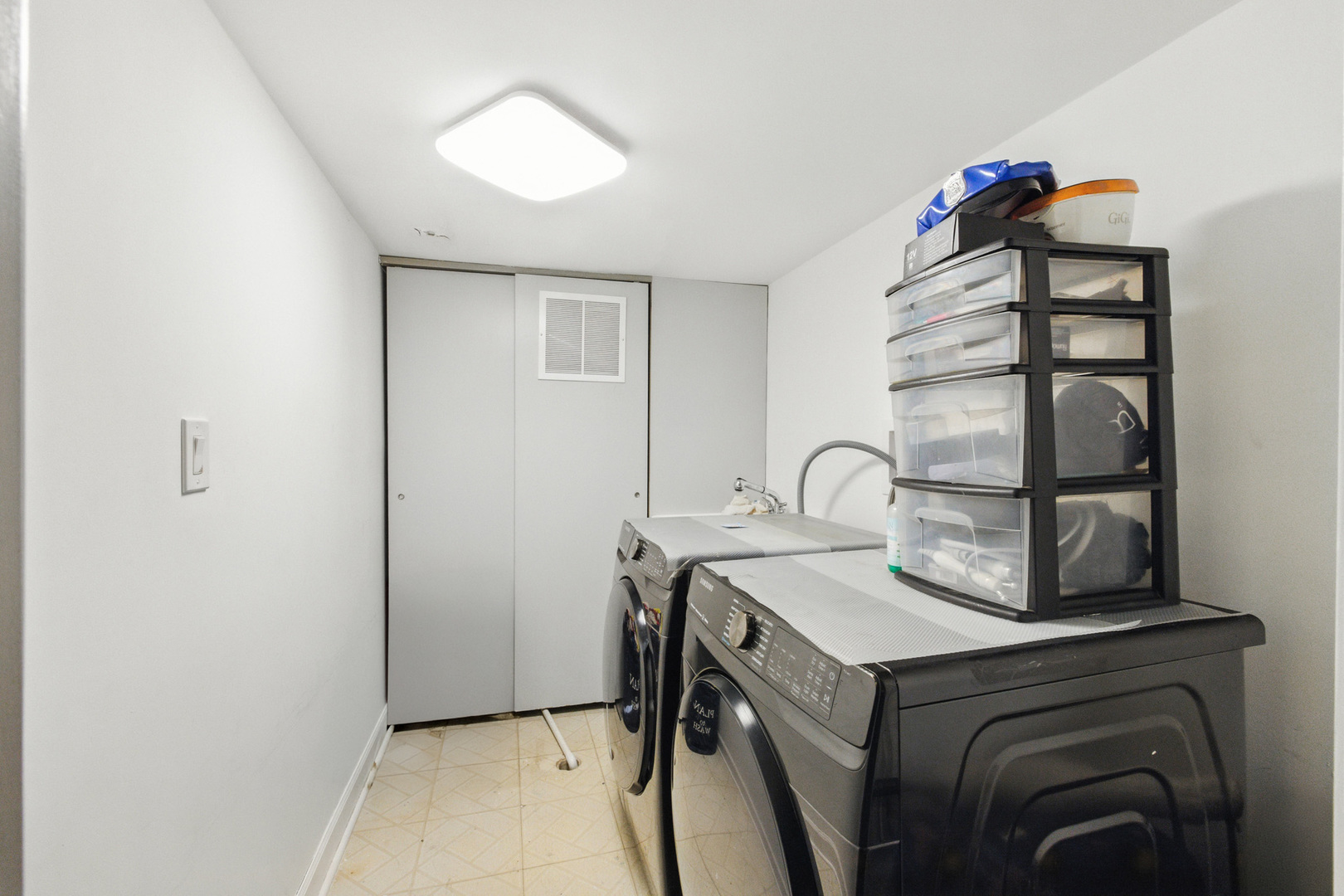 2938 East Shagbark Trail Crete, IL 60417 - Photo 24 of 26 a view of a storage and utility room with washer and dryer