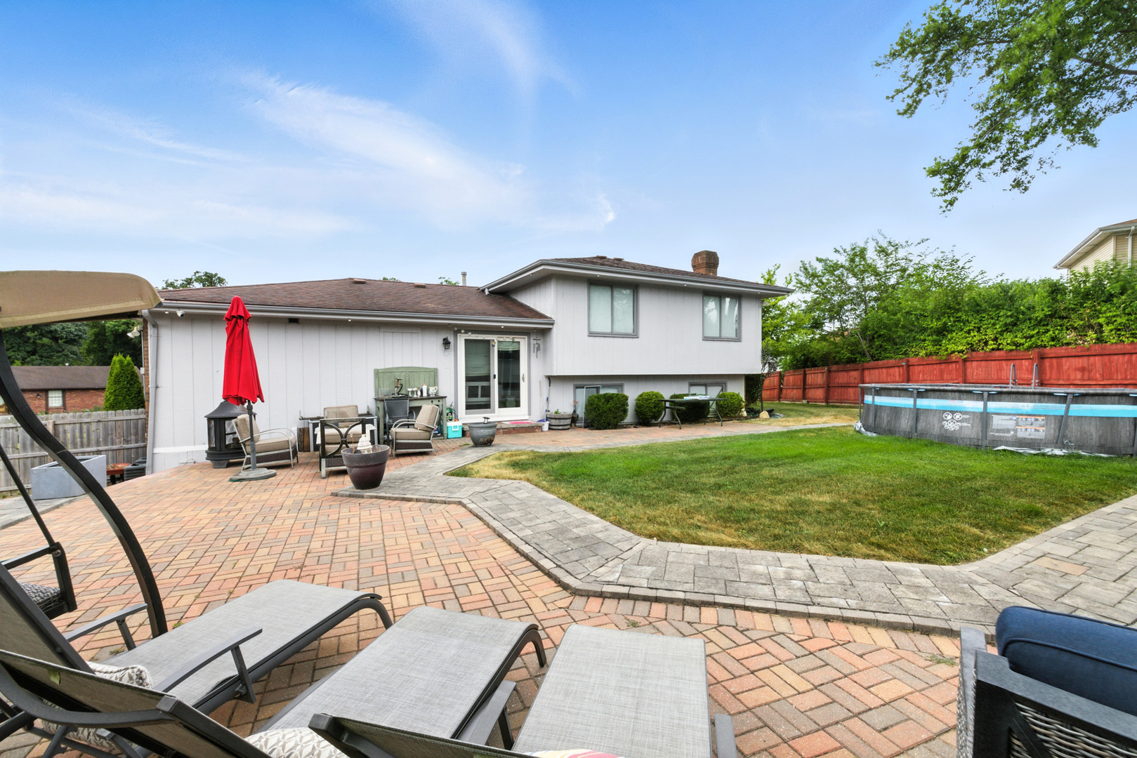 2938 East Shagbark Trail Crete, IL 60417 - Photo 26 of 26 a view of a house with backyard sitting area and garden