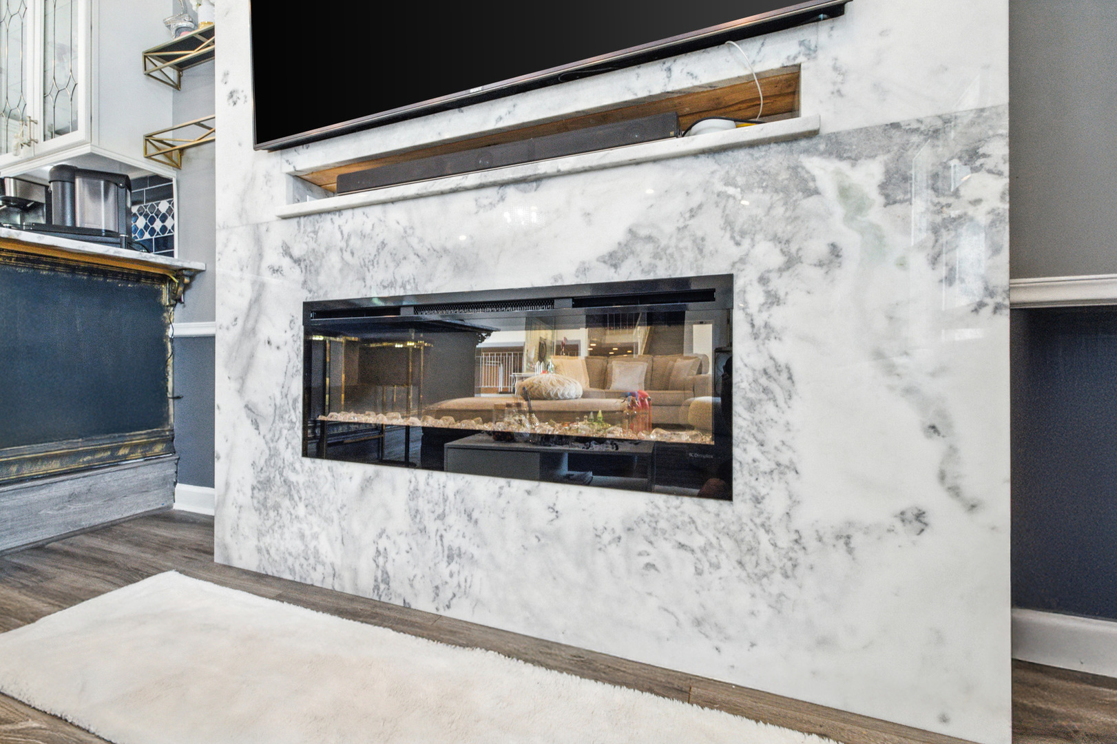 2938 East Shagbark Trail Crete, IL 60417 - Photo 6 of 26 a living room with a fireplace and a flat screen tv