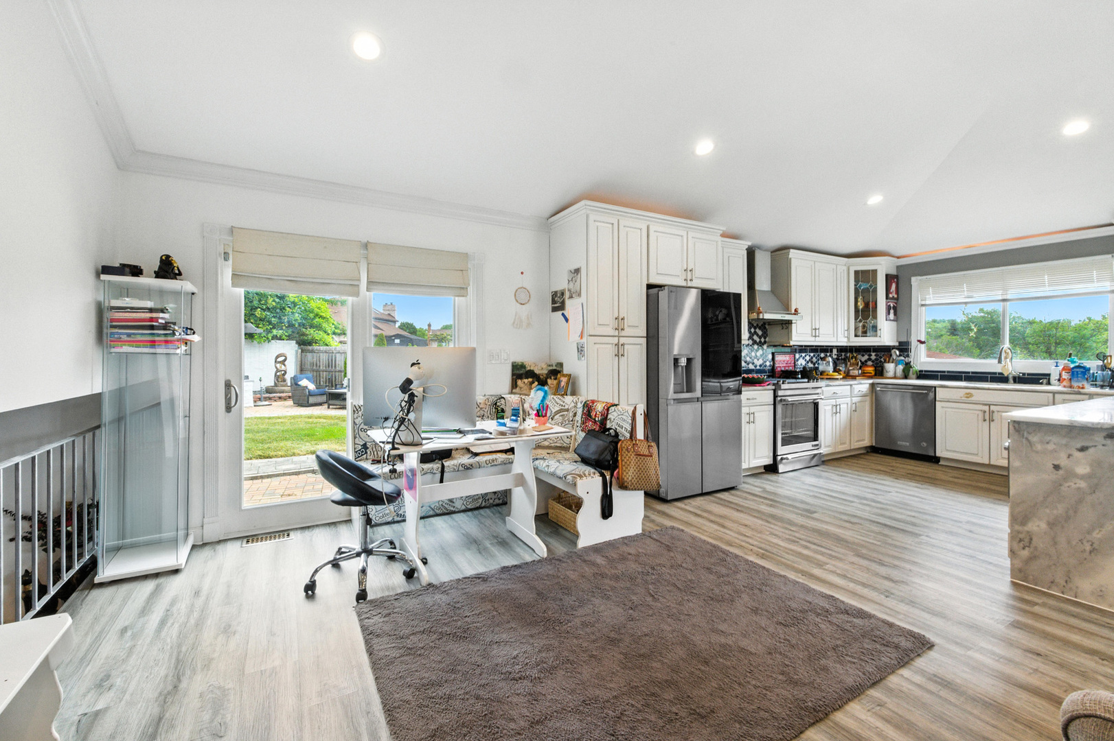 2938 East Shagbark Trail Crete, IL 60417 - Photo 10 of 26 a view of a kitchen with dining table and stainless steel appliances