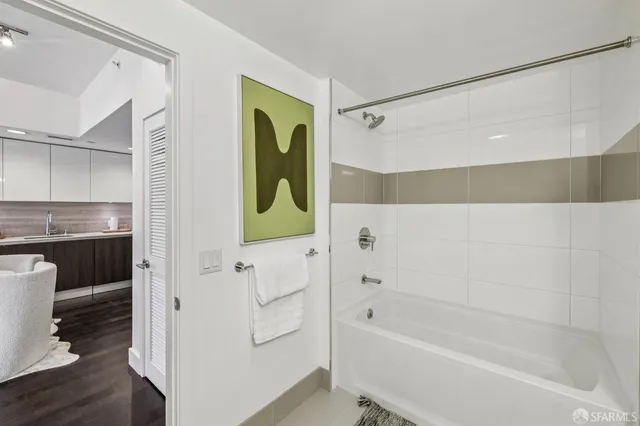 a bathroom with a bathtub and a shower