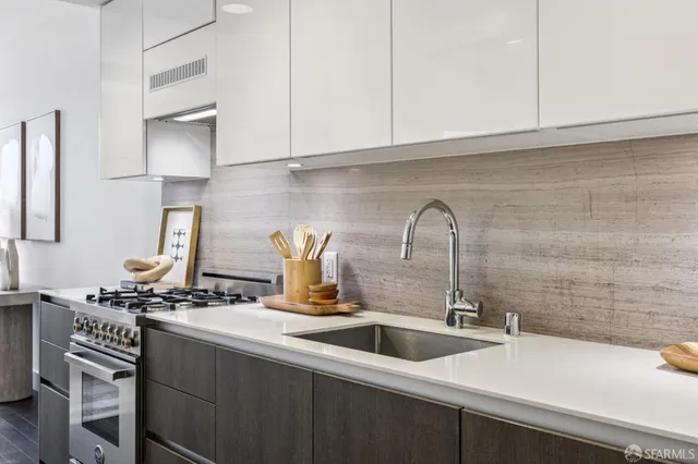 a kitchen with a sink and cabinets