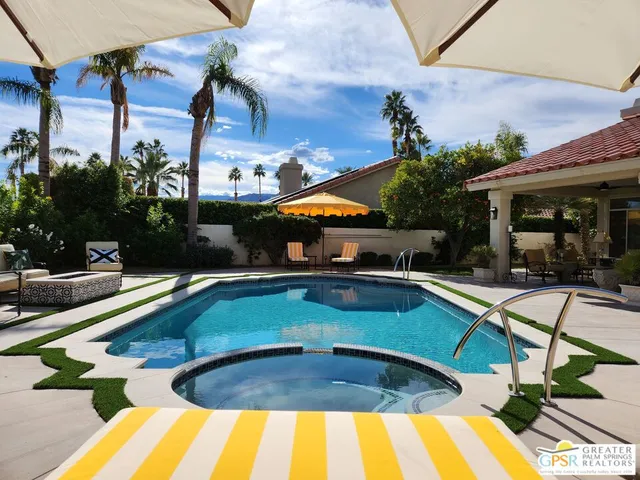 a view of a swimming pool with a patio