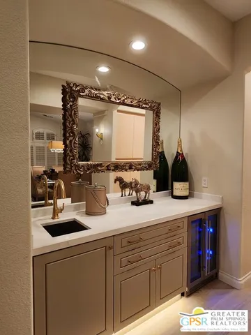 a kitchen with kitchen island granite countertop a sink and white appliances