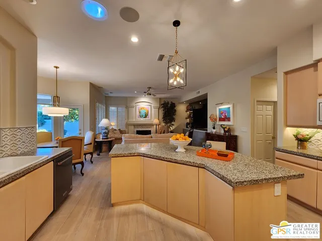 a spacious bedroom with a bed and a flat screen tv