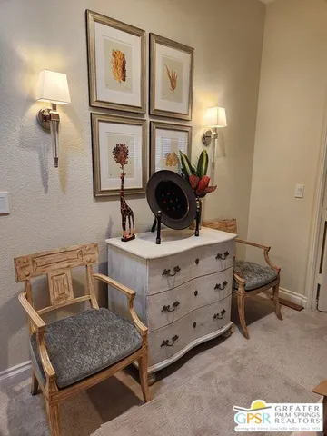 a bedroom with bed tv and flat screen tv
