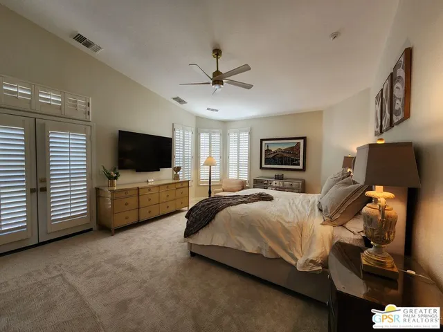 a large white kitchen with a large window