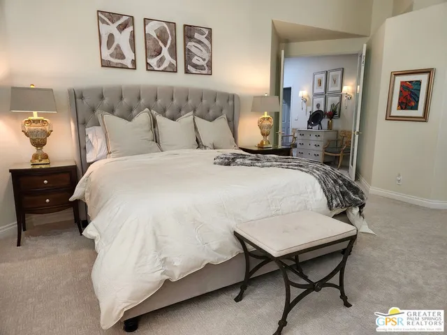 a bathroom with a tub a sink a mirror and a shower