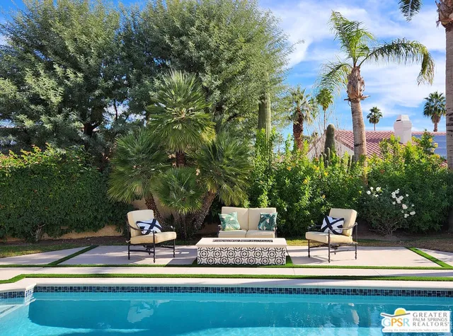 a view of a chairs and table in the patio