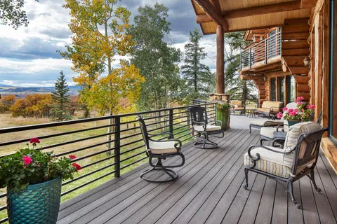 a view of chairs and tables in the balcony