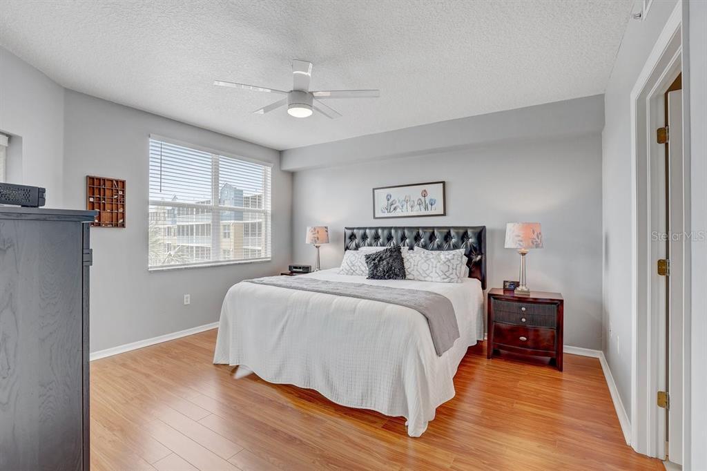 960 Starkey Road, Unit 2405 Largo, FL 33771 - Photo 16 of 31 a bedroom with a large bed and a window