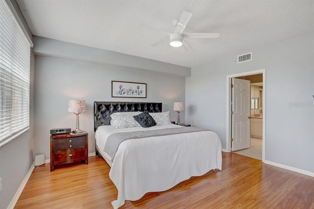 960 Starkey Road, Unit 2405 Largo, FL 33771 - Photo 17 of 31 a bedroom with a bed and a night stand
