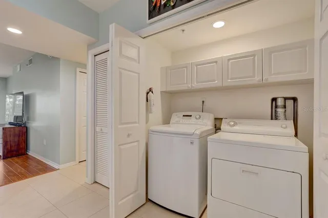 a view of storage and utility room with washer and dryer