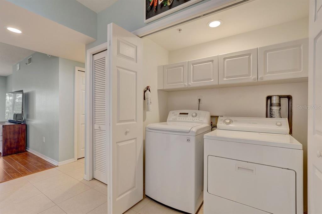 960 Starkey Road, Unit 2405 Largo, FL 33771 - Photo 26 of 31 a view of storage and utility room with washer and dryer