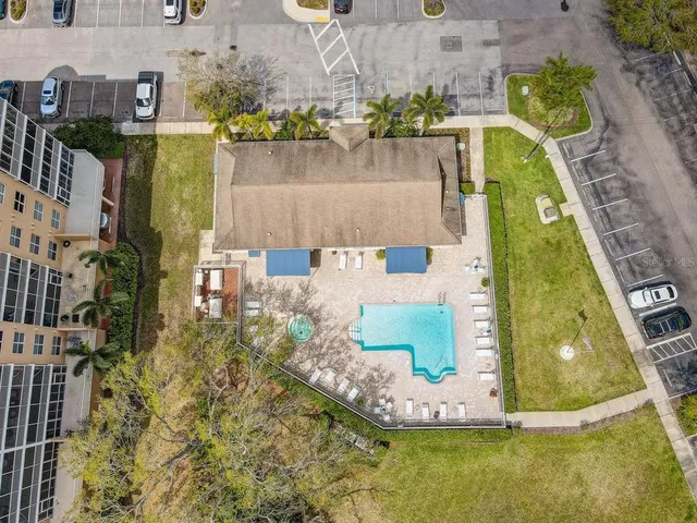 an aerial view of a residential houses with outdoor space
