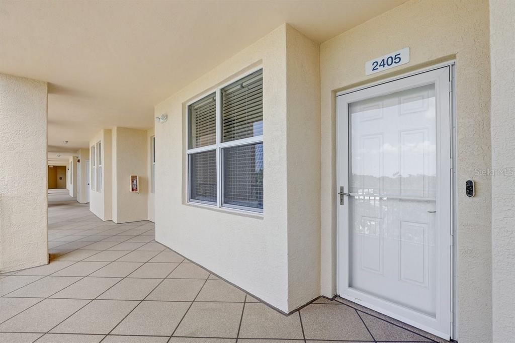 960 Starkey Road, Unit 2405 Largo, FL 33771 - Photo 3 of 31 a view of an empty room with window and stairs