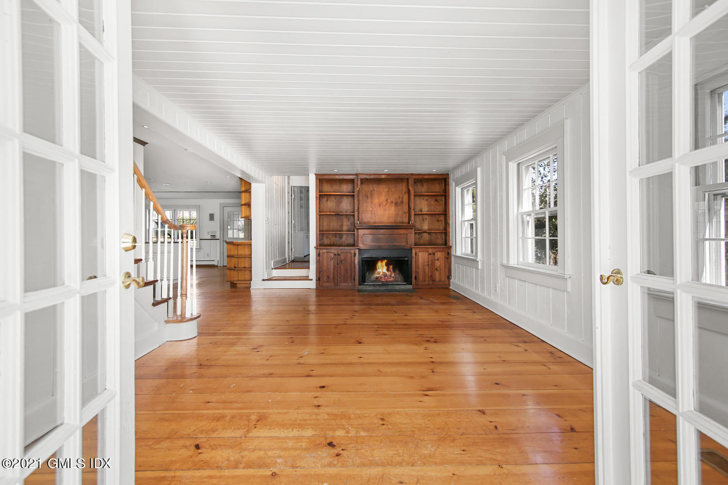 187 Stanwich Road Greenwich, CT 06830 - Photo 11 of 31 a view of a livingroom with wooden floor and a refrigerator