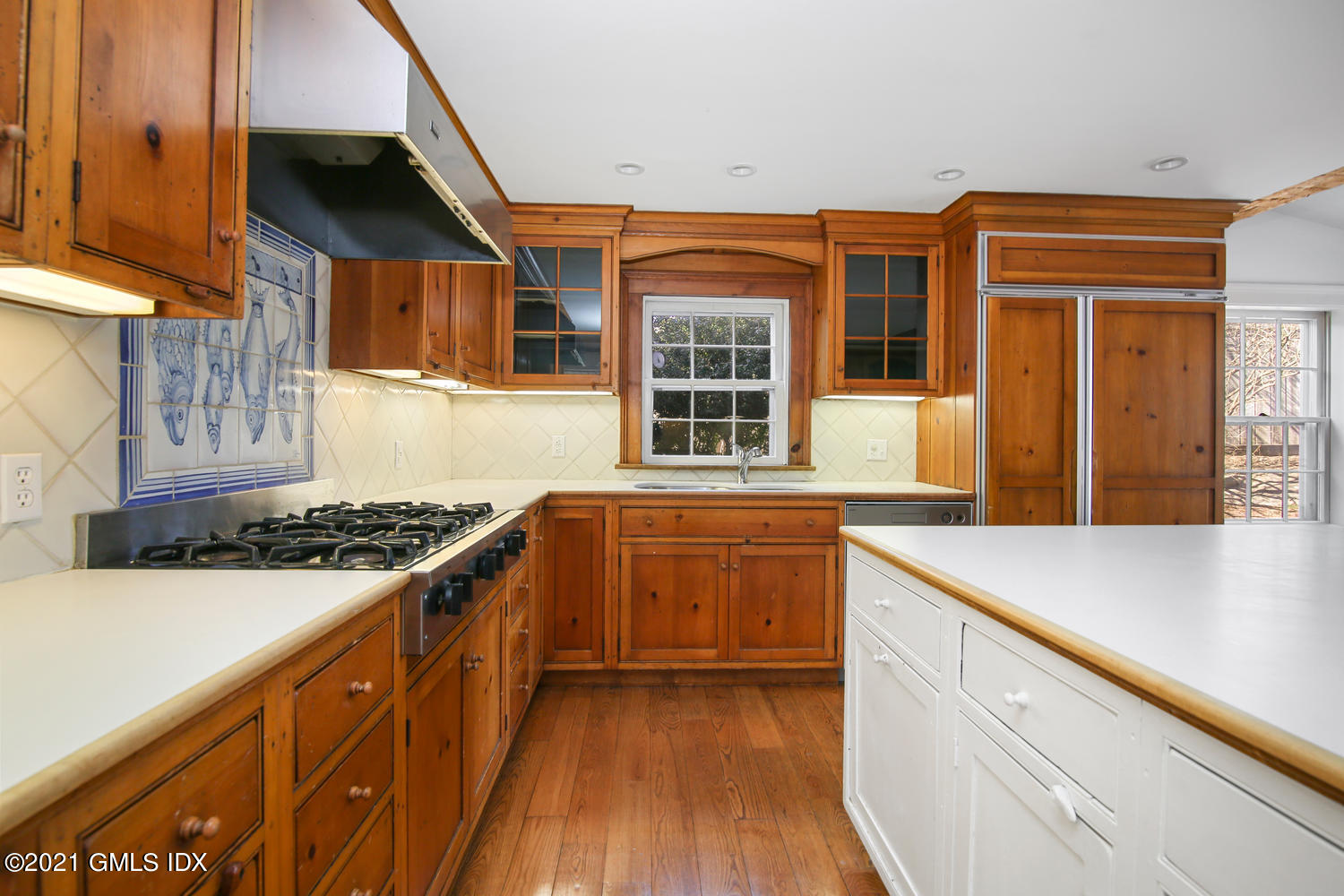 187 Stanwich Road Greenwich, CT 06830 - Photo 12 of 31 a kitchen with stainless steel appliances granite countertop a stove and a sink